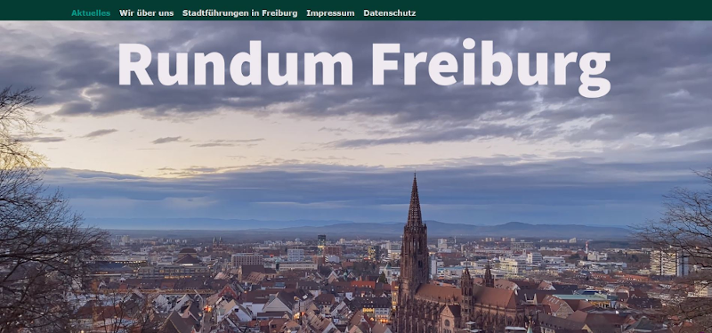 Website von RundumFreiburg mit Blick über Freiburg und das Münster